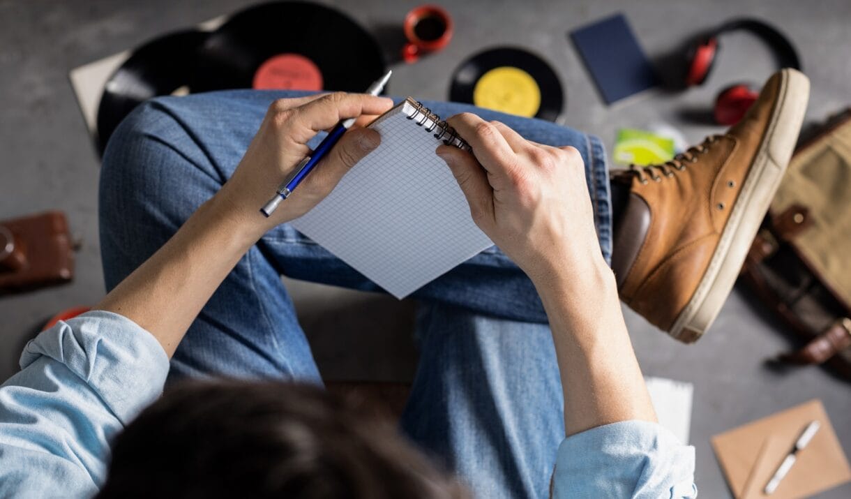 Male Hand Holding Pen Or Pencil And Notebook Stude 5S89XTH 1220x715