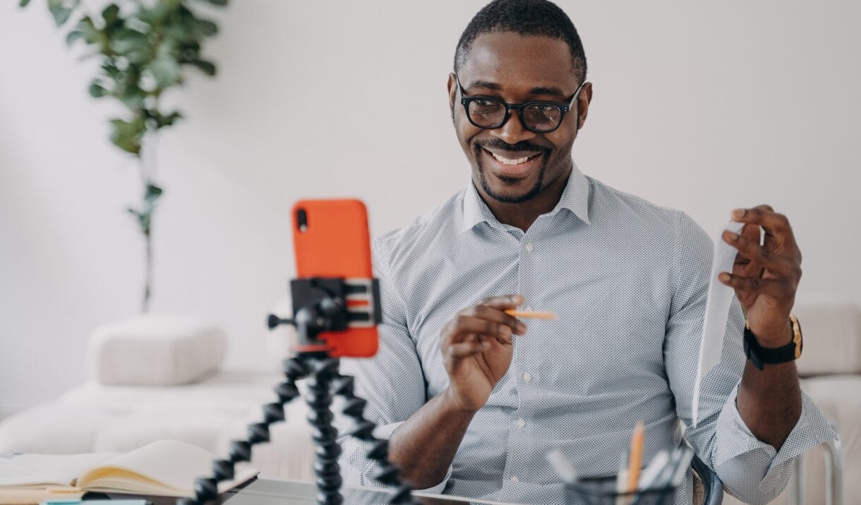 Smiling African American Businessman Presenting Bu TAGXJTJ 1220x715