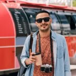 Young Male Photographer With Drink And Photocamera DHDDJAV 150x150