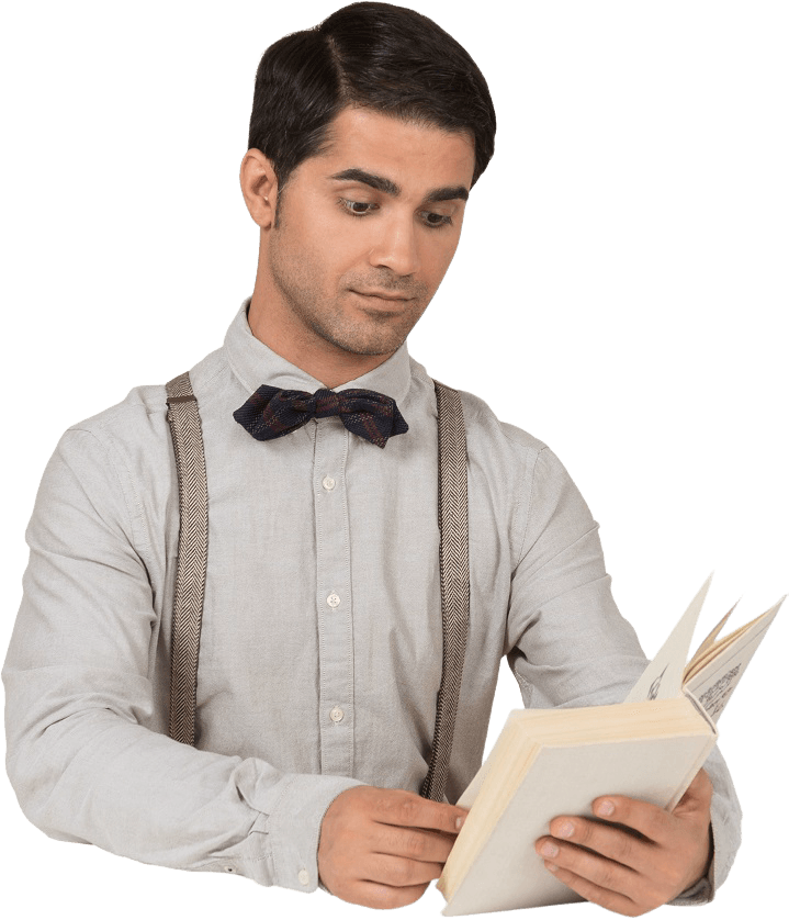 A Man Wearing Suspenders And A Bow Tie Reading A B NYGDK9P