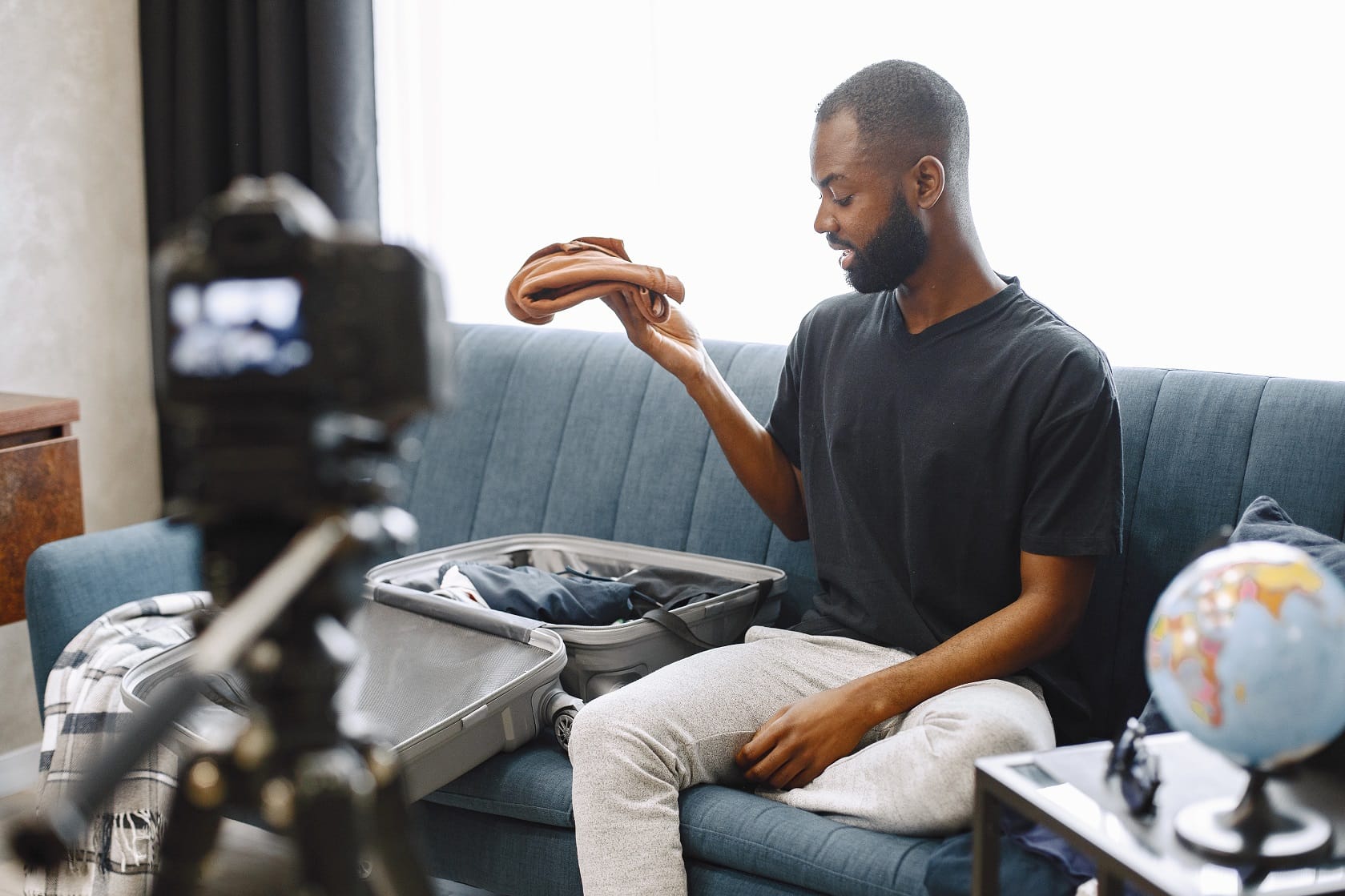 African Male Blogger Recording Vlog On Digital Cam KMQE9F5